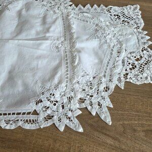 Set of 3 white linen doily with cutwork on the edges.